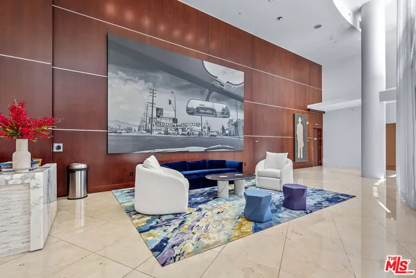 a room with furniture a flat screen tv and a faucet