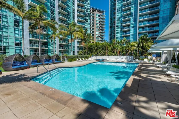 a view of a large building with a swimming pool