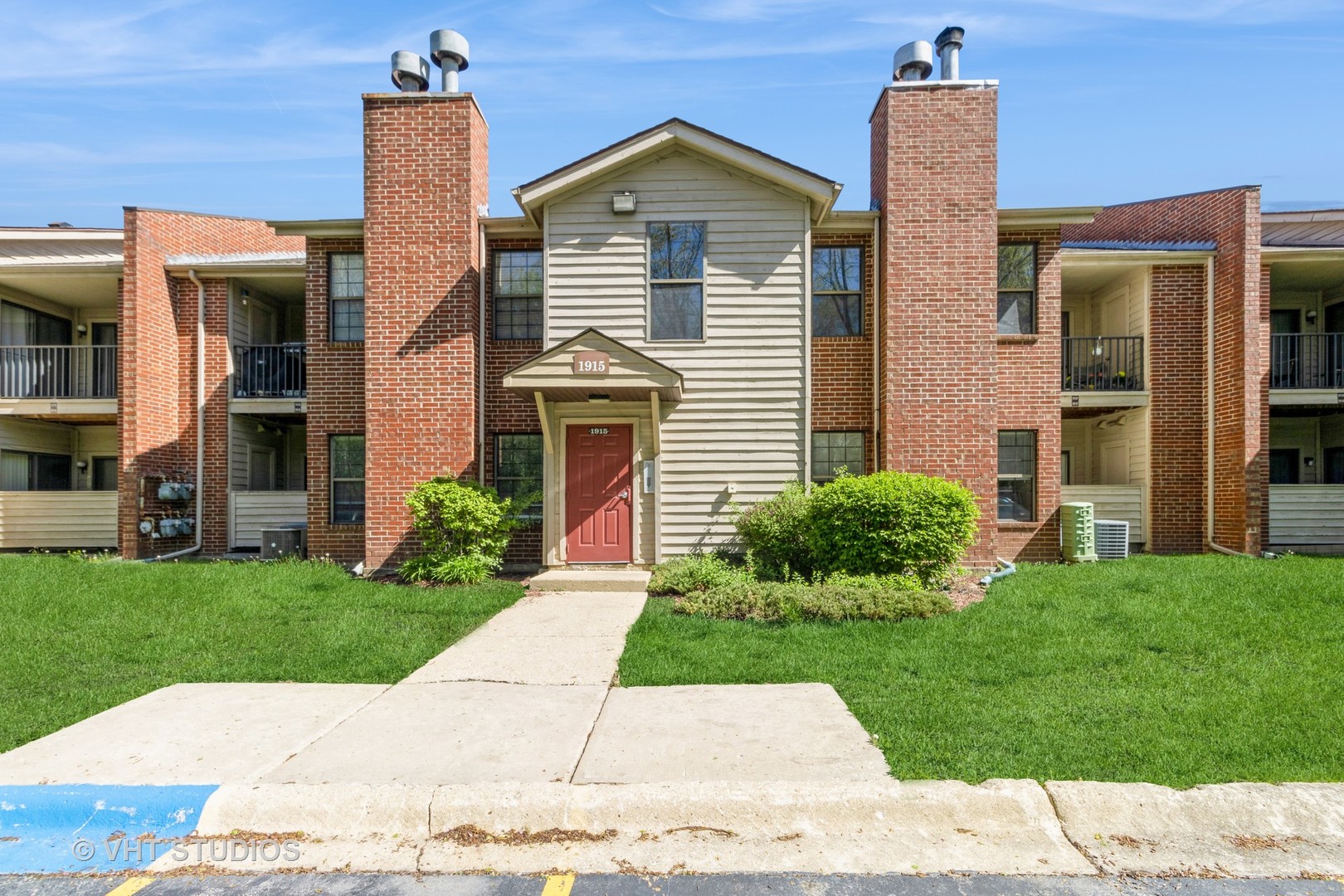 1915 North Hicks Road, Unit 106 Palatine, IL 60074 - Photo 2 of 11 a view of a house with a yard