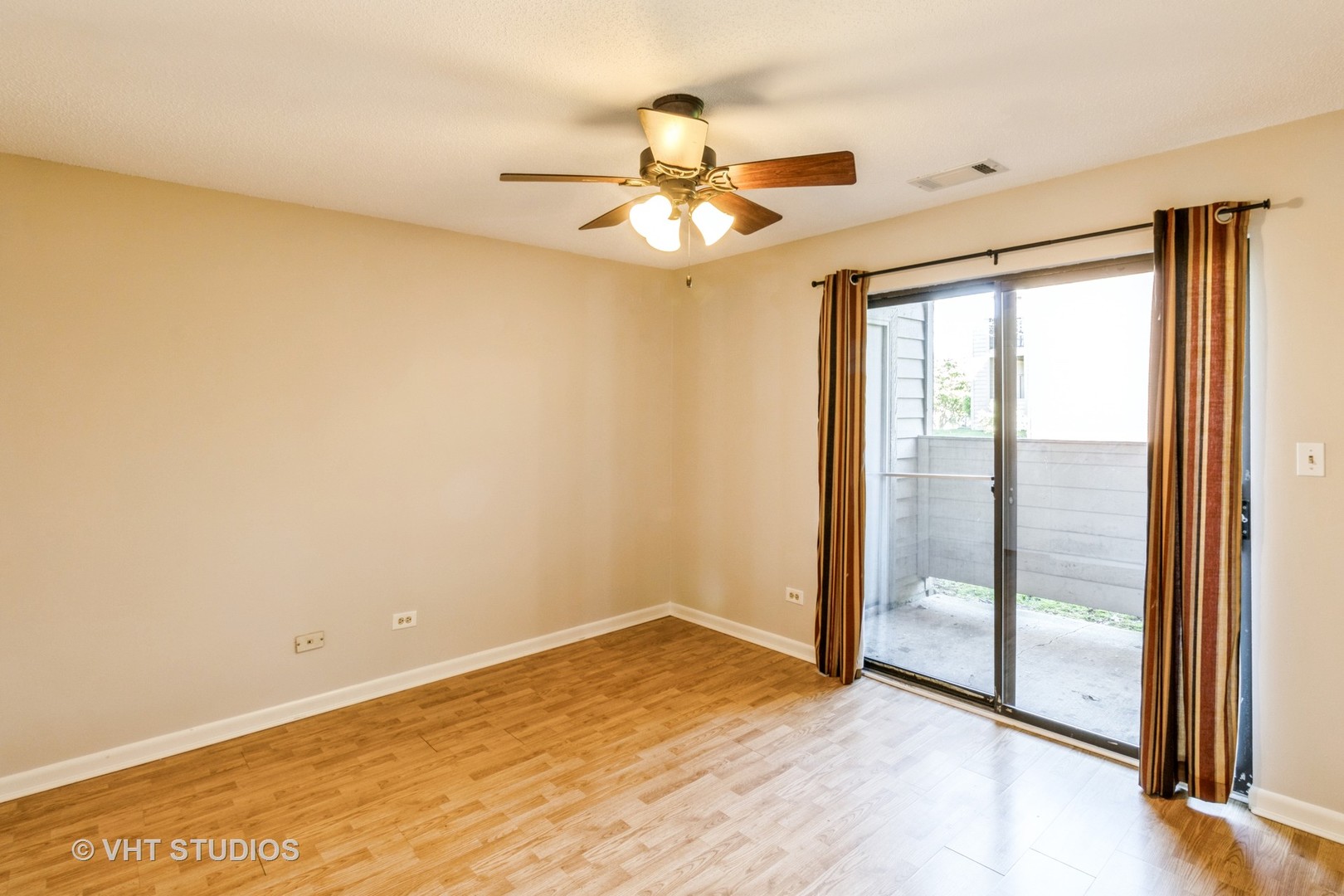 1915 North Hicks Road, Unit 106 Palatine, IL 60074 - Photo 8 of 11 a view of an empty room and window