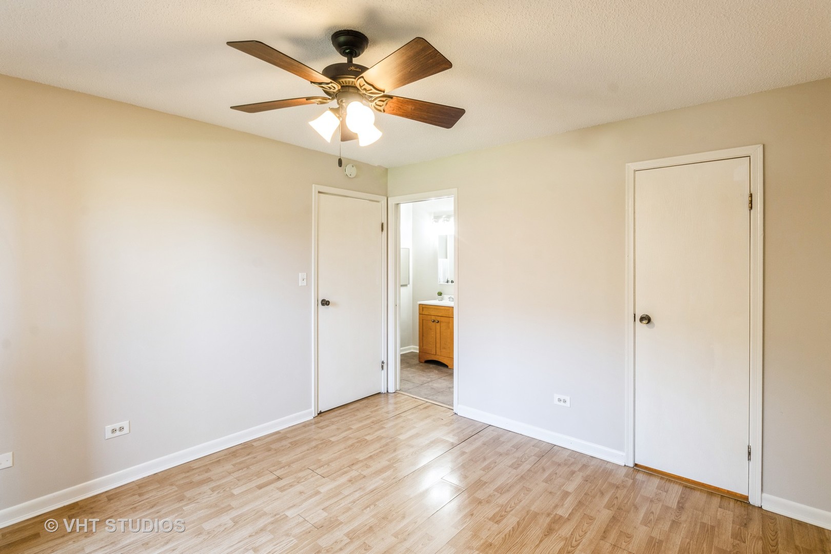 1915 North Hicks Road, Unit 106 Palatine, IL 60074 - Photo 9 of 11 wooden floor in an empty room