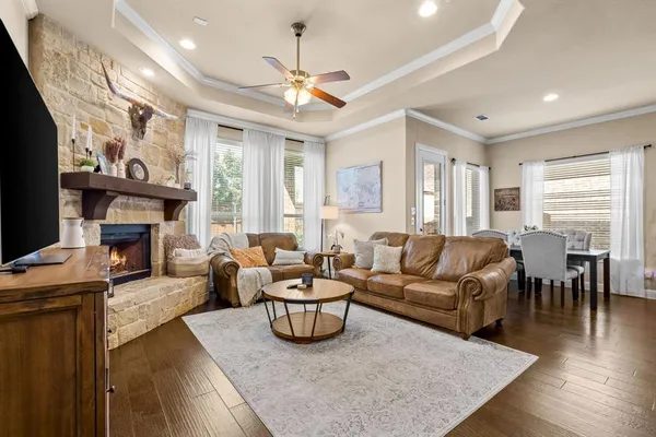 a living room with furniture fireplace and a flat screen tv