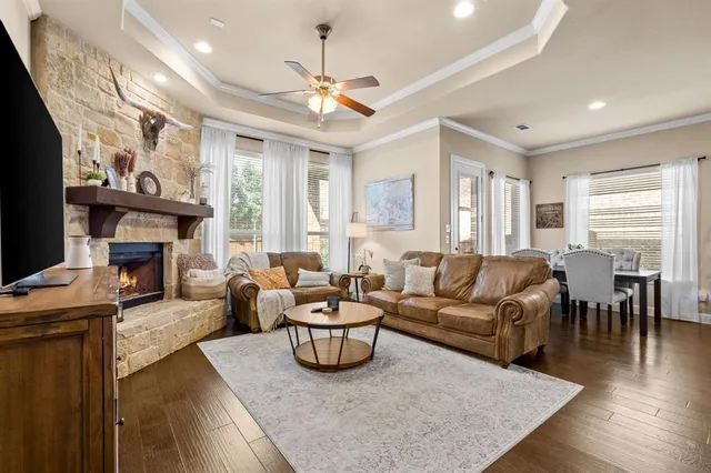 a living room with furniture fireplace and a flat screen tv