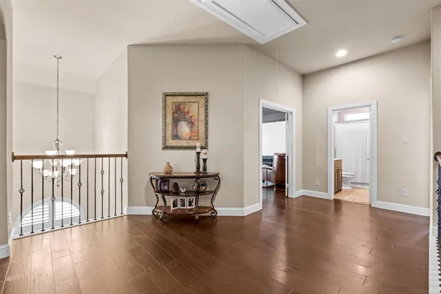 a view of a livingroom with furniture and hardwood floor