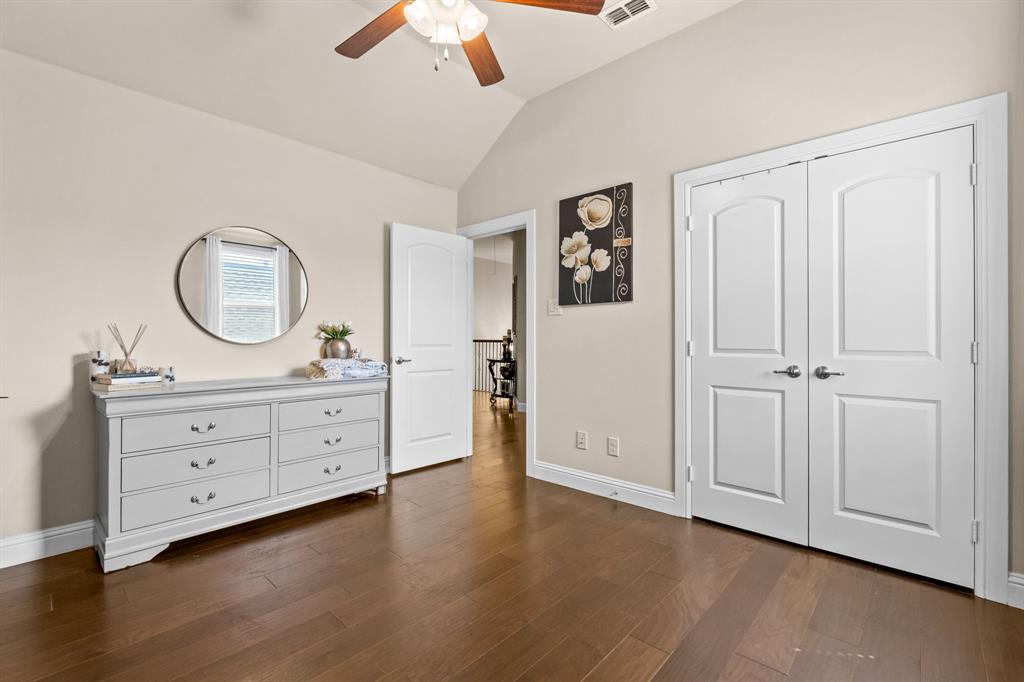 1729 Halifax Street Roanoke, TX 76262 - Photo 24 of 40 a room with a mirror and a dresser in it