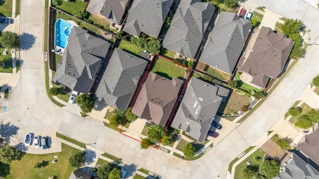 an aerial view of a house with a garden