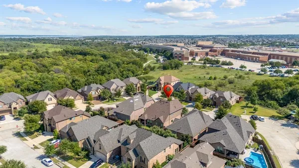 an aerial view of a houses with a lake view