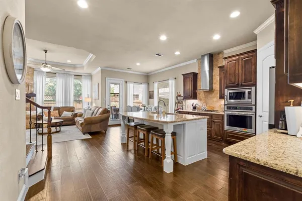 a kitchen with stainless steel appliances granite countertop lots of counter top space