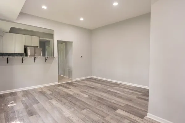 a view of a livingroom with wooden floor
