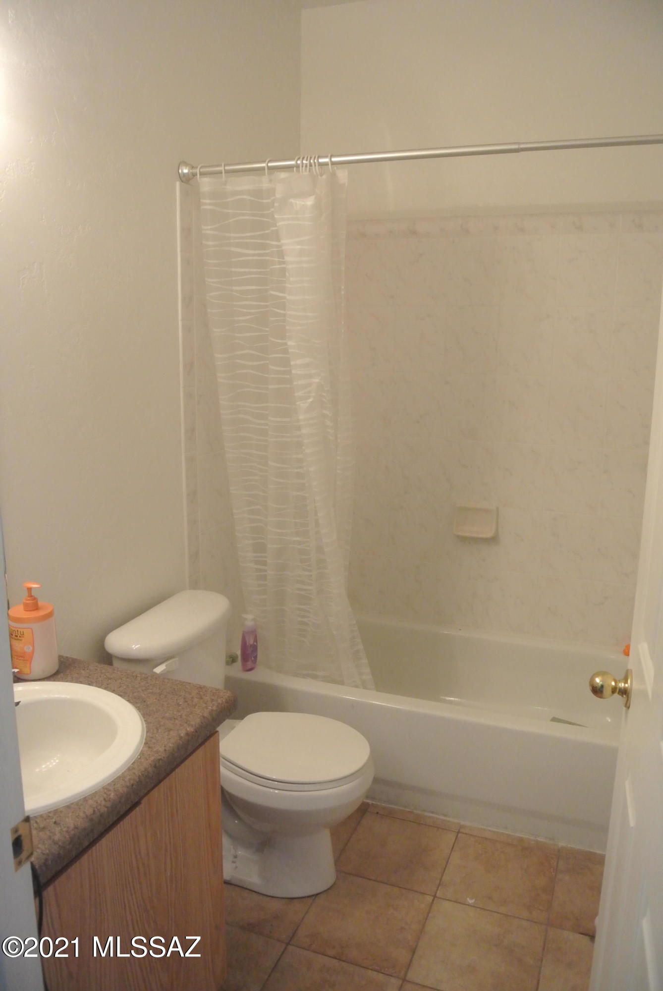 3524 South Mission Road, Unit 5 Tucson, AZ 85713 - Photo 14 of 19 a bathroom with a toilet a sink and a shower