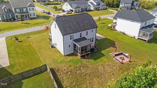 an aerial view of a house with swimming pool