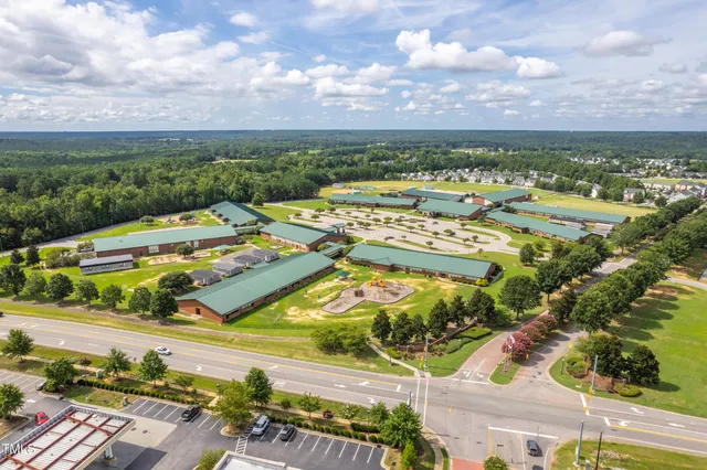 an aerial view of residential houses with outdoor space