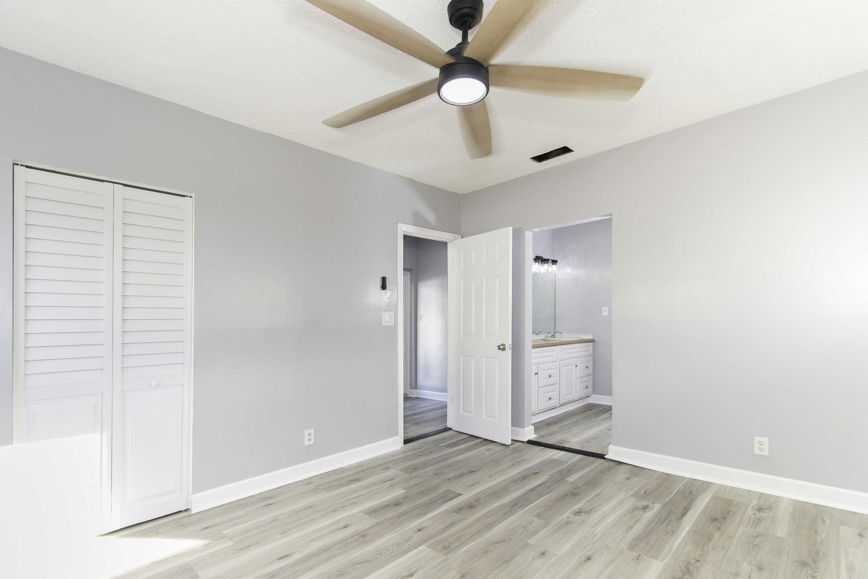 1571 Southwest 13th Drive Boca Raton, FL 33486 - Photo 11 of 21 wooden floor in an empty room