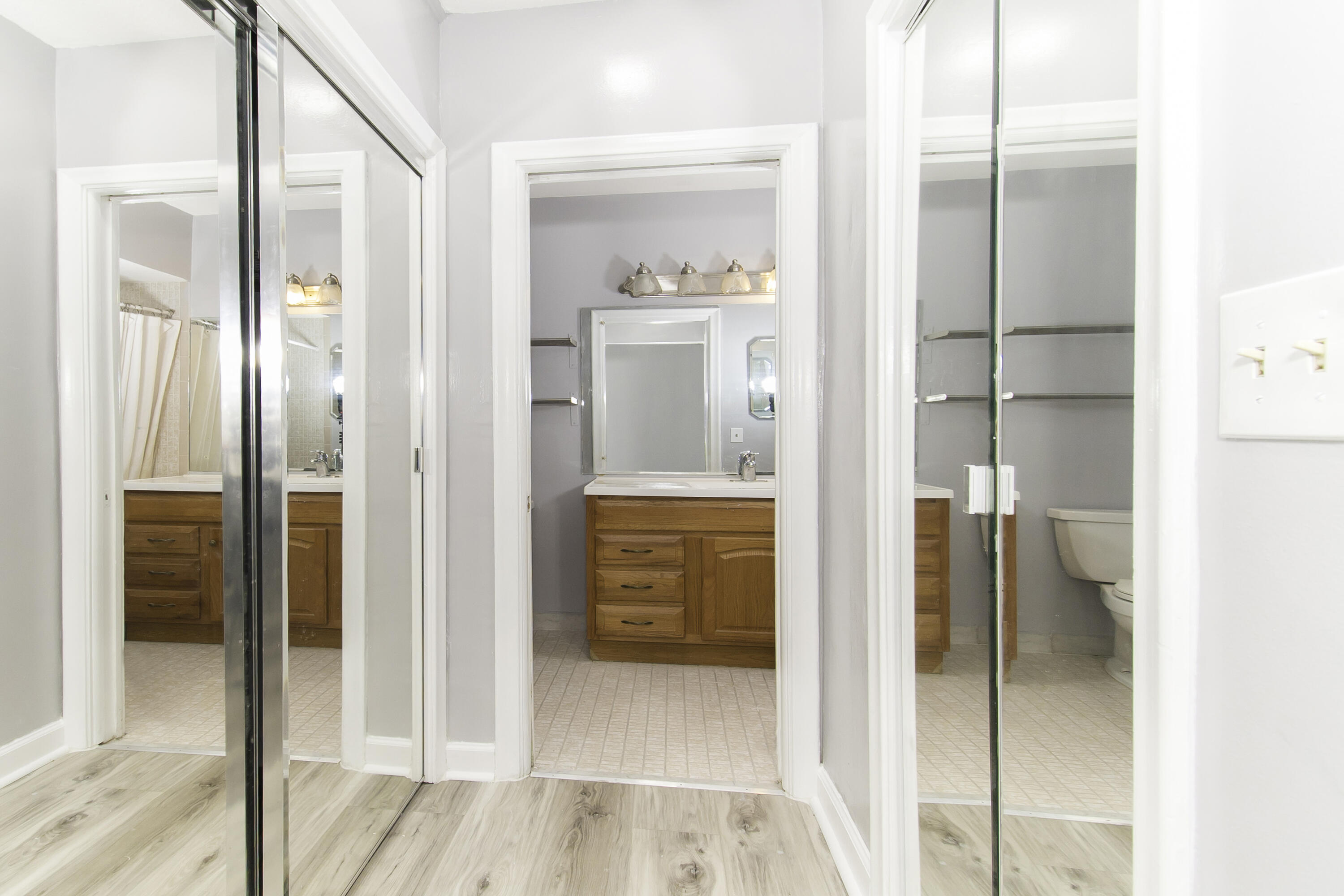 1571 Southwest 13th Drive Boca Raton, FL 33486 - Photo 15 of 21 a bathroom with a glass shower door and a mirror