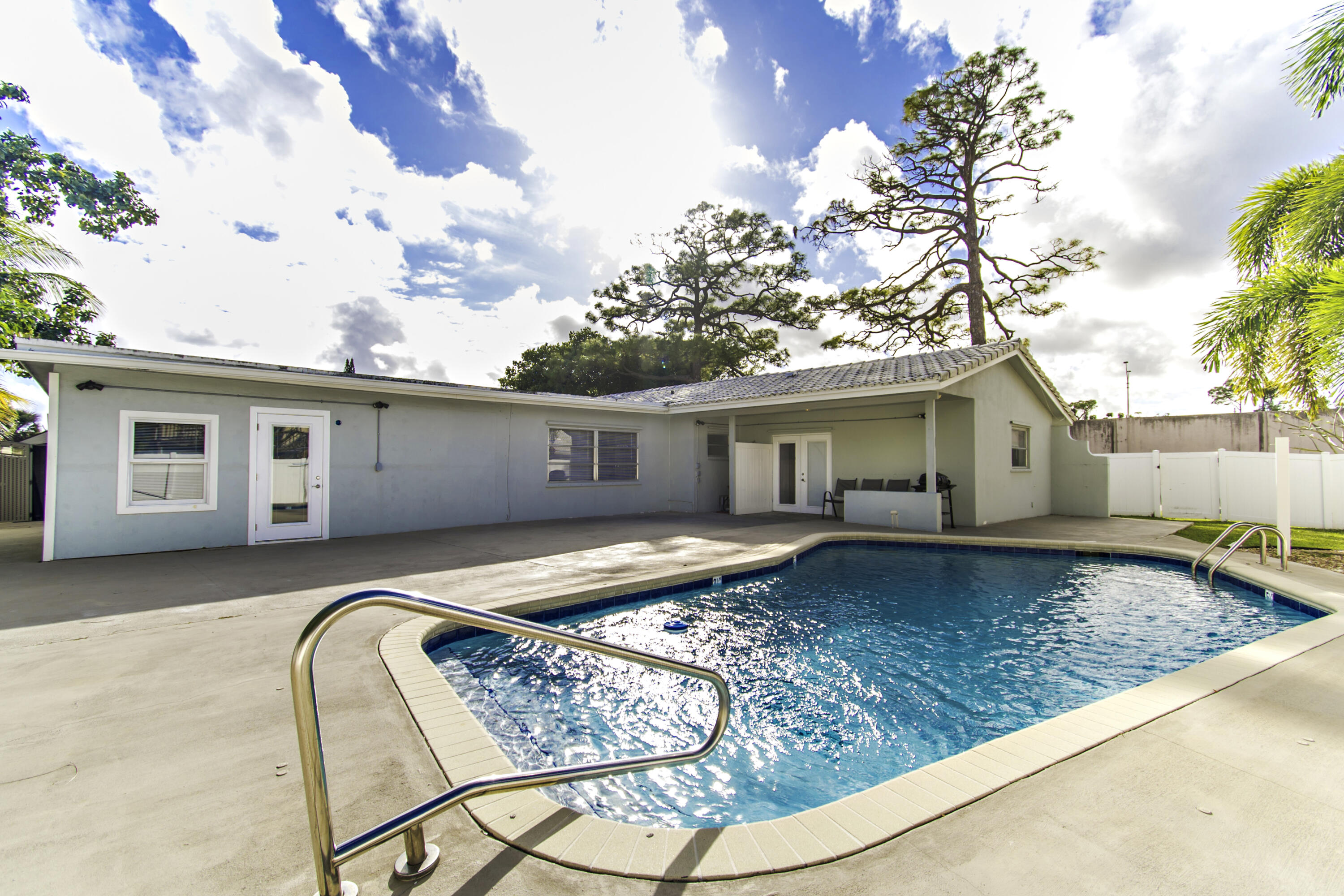 1571 Southwest 13th Drive Boca Raton, FL 33486 - Photo 17 of 21 a front view of a house with garden