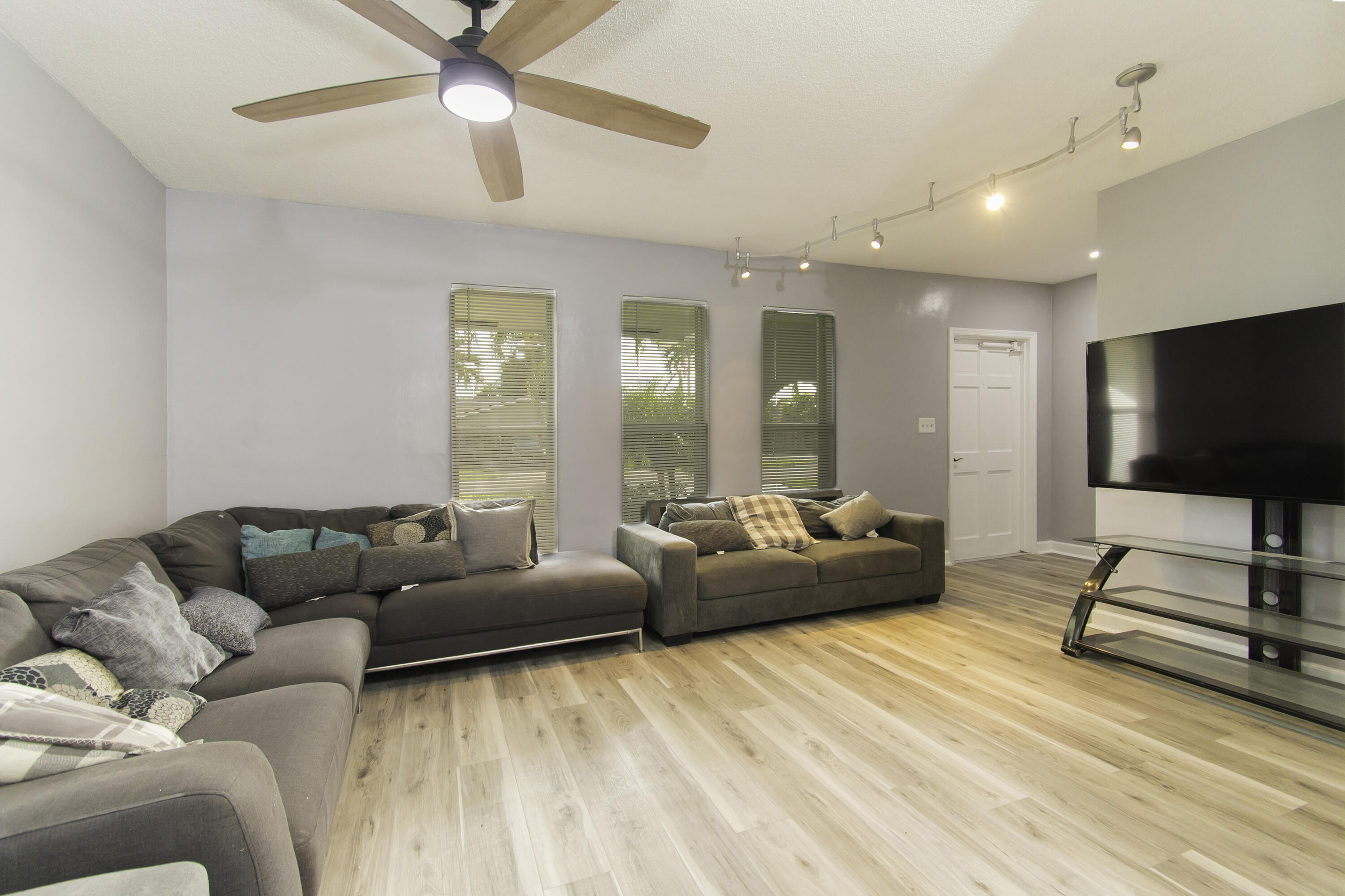 1571 Southwest 13th Drive Boca Raton, FL 33486 - Photo 5 of 21 a living room with furniture and a flat screen tv