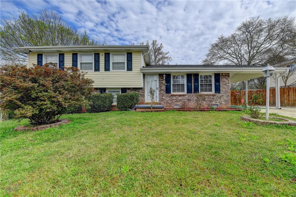 front view of a house with a yard