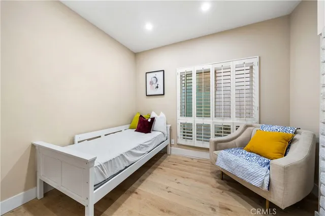 a bedroom with a bed and a couch