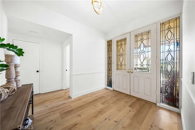 a view of livingroom with hardwood floor and hallway