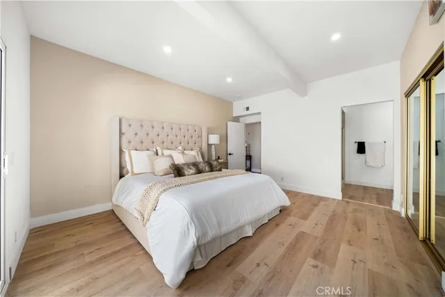 a bedroom with a bed and a walk in closet