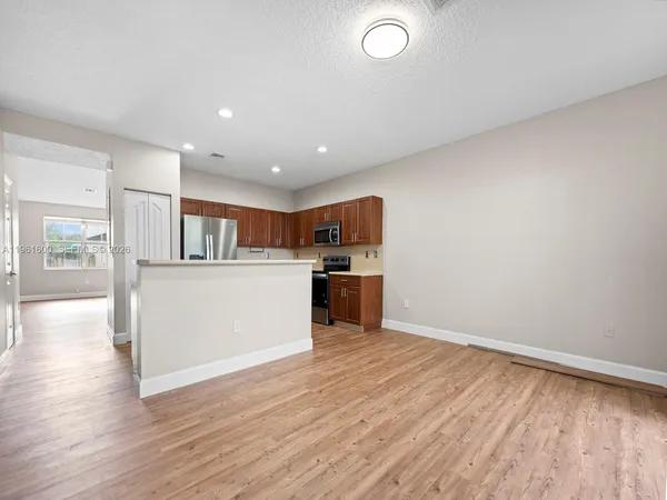 a view of kitchen with wooden floor