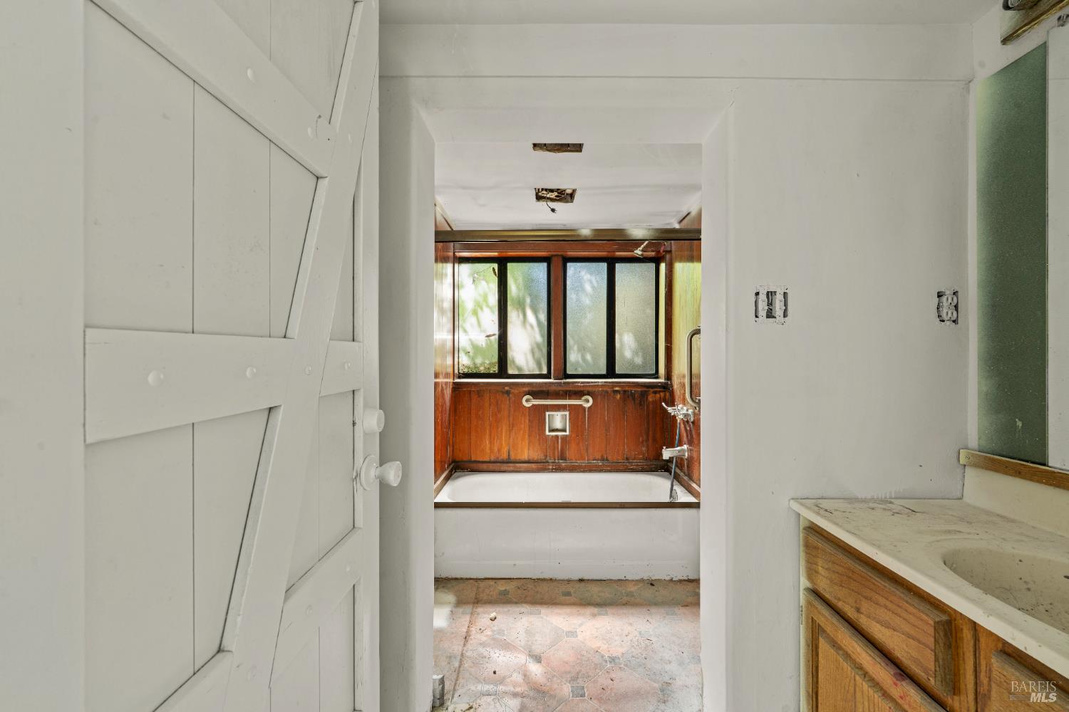 10991 River Road Forestville, CA 95436 - Photo 18 of 20 a bathroom with a sink and a mirror
