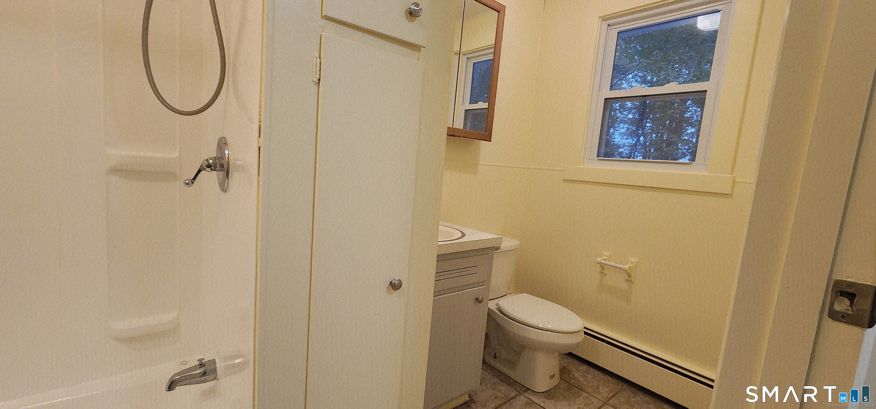 1267-unit B Thompson Road Thompson, CT 06277 - Photo 2 of 7 a bathroom with a granite countertop shower a toilet and a sink