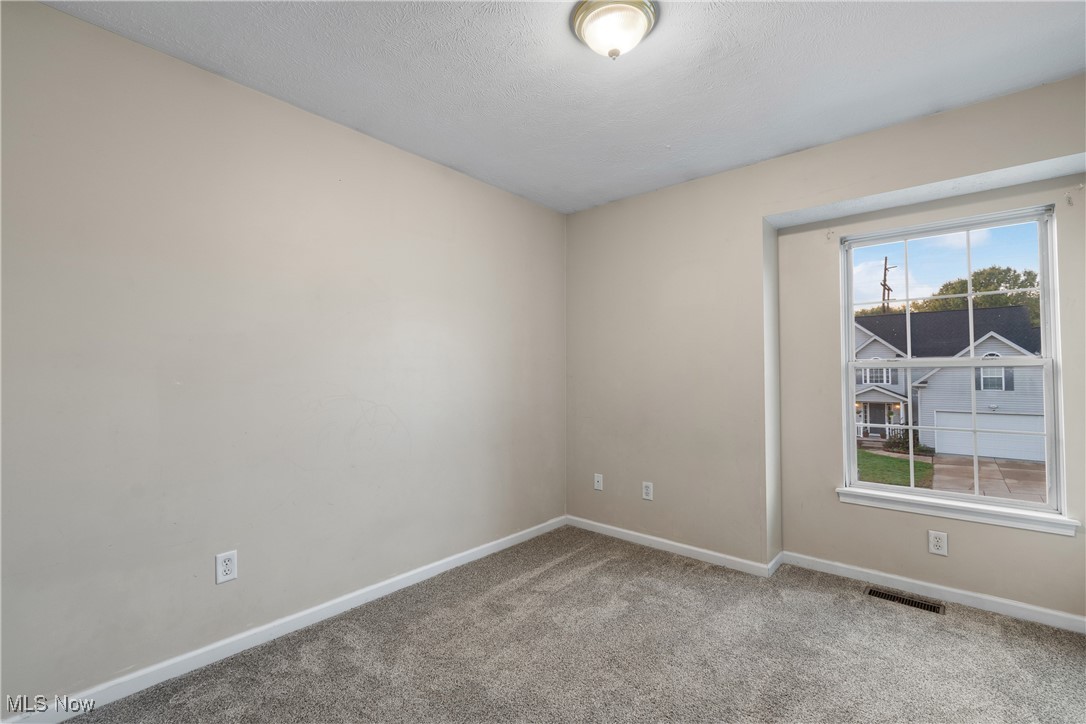 1333 Derbydale Road Akron, OH 44306 - Photo 17 of 29 Bedroom 2 with carpet flooring and a large window.