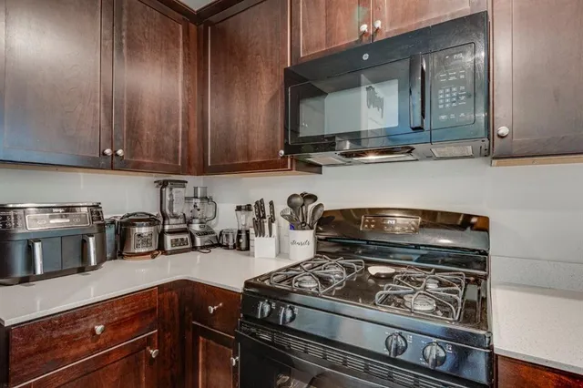 a kitchen with a stove and a microwave