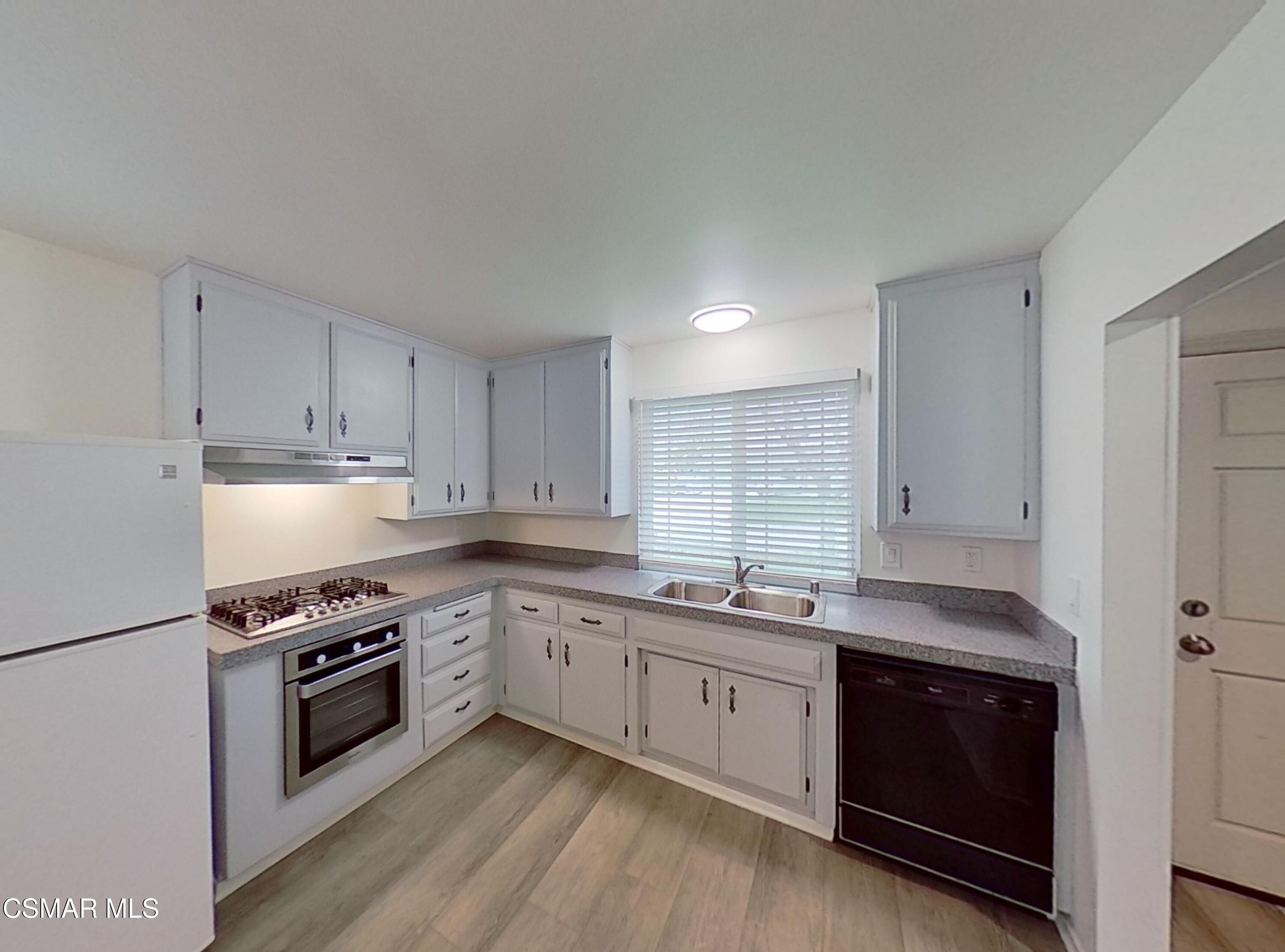 577 Appleton Road Simi Valley, CA 93065 - Photo 11 of 31 a kitchen with stainless steel appliances granite countertop a stove a sink and a refrigerator