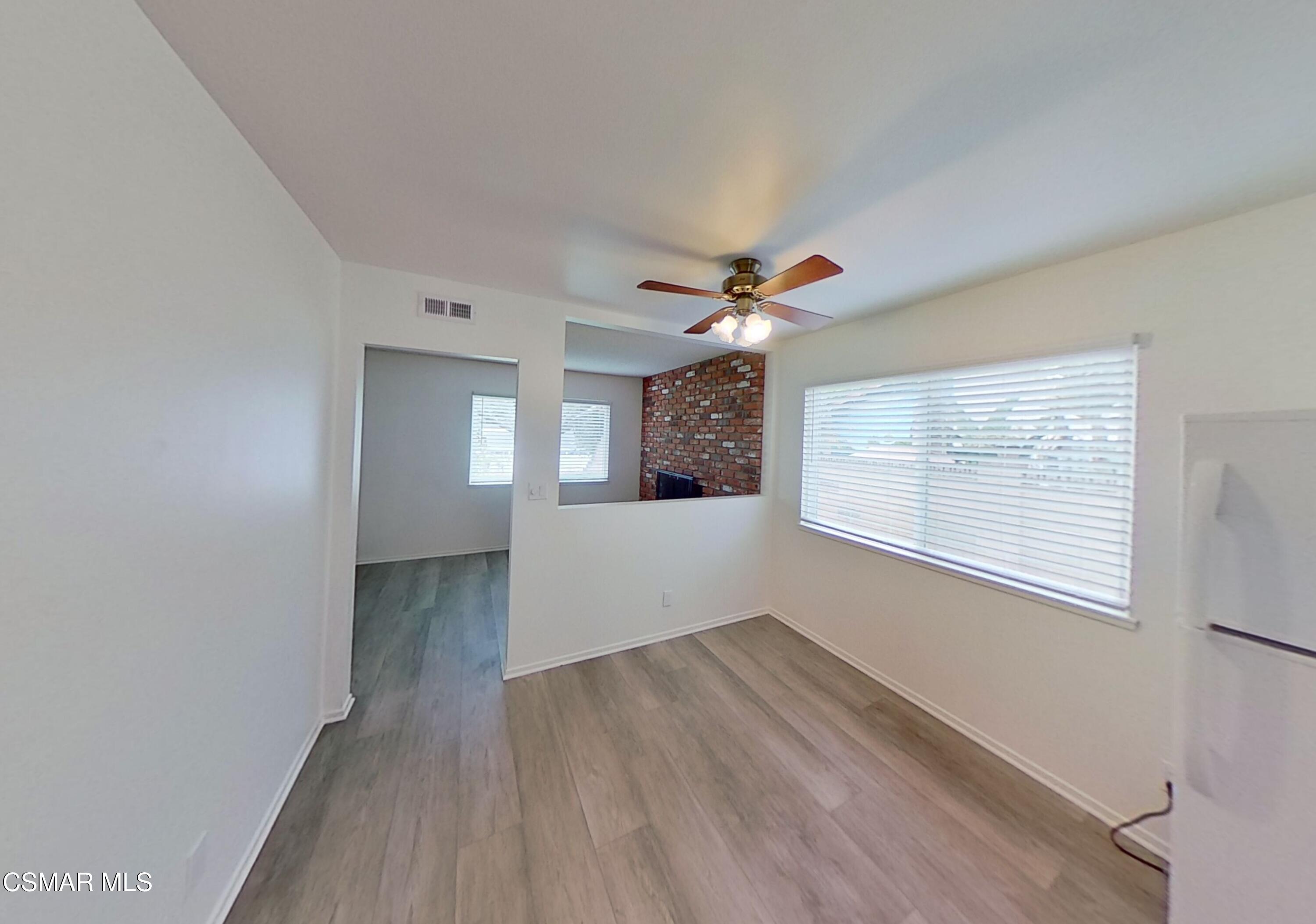 577 Appleton Road Simi Valley, CA 93065 - Photo 13 of 31 a view of empty room with wooden floor and fan