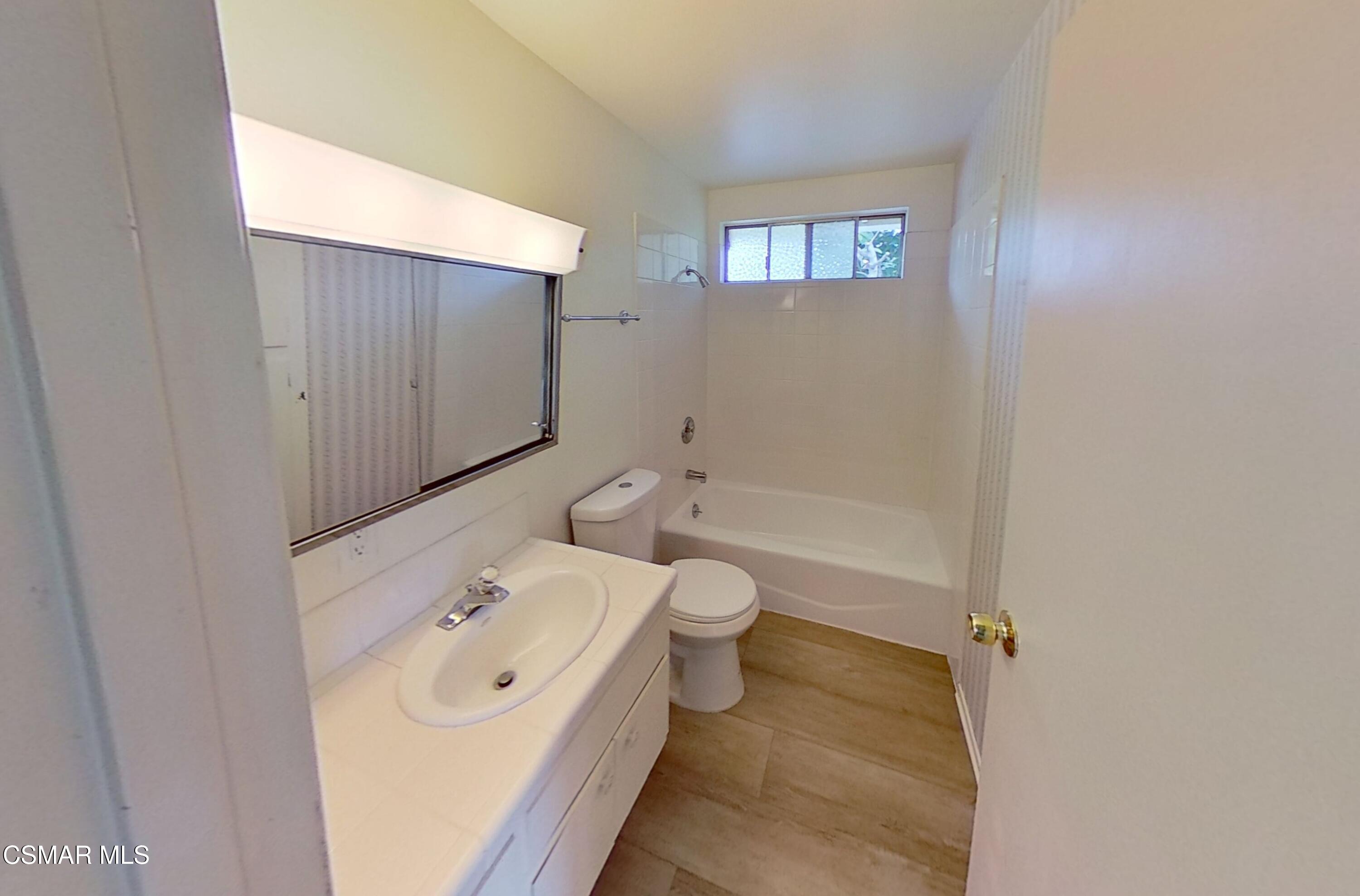 577 Appleton Road Simi Valley, CA 93065 - Photo 24 of 31 a bathroom with a sink a toilet and a bathtub