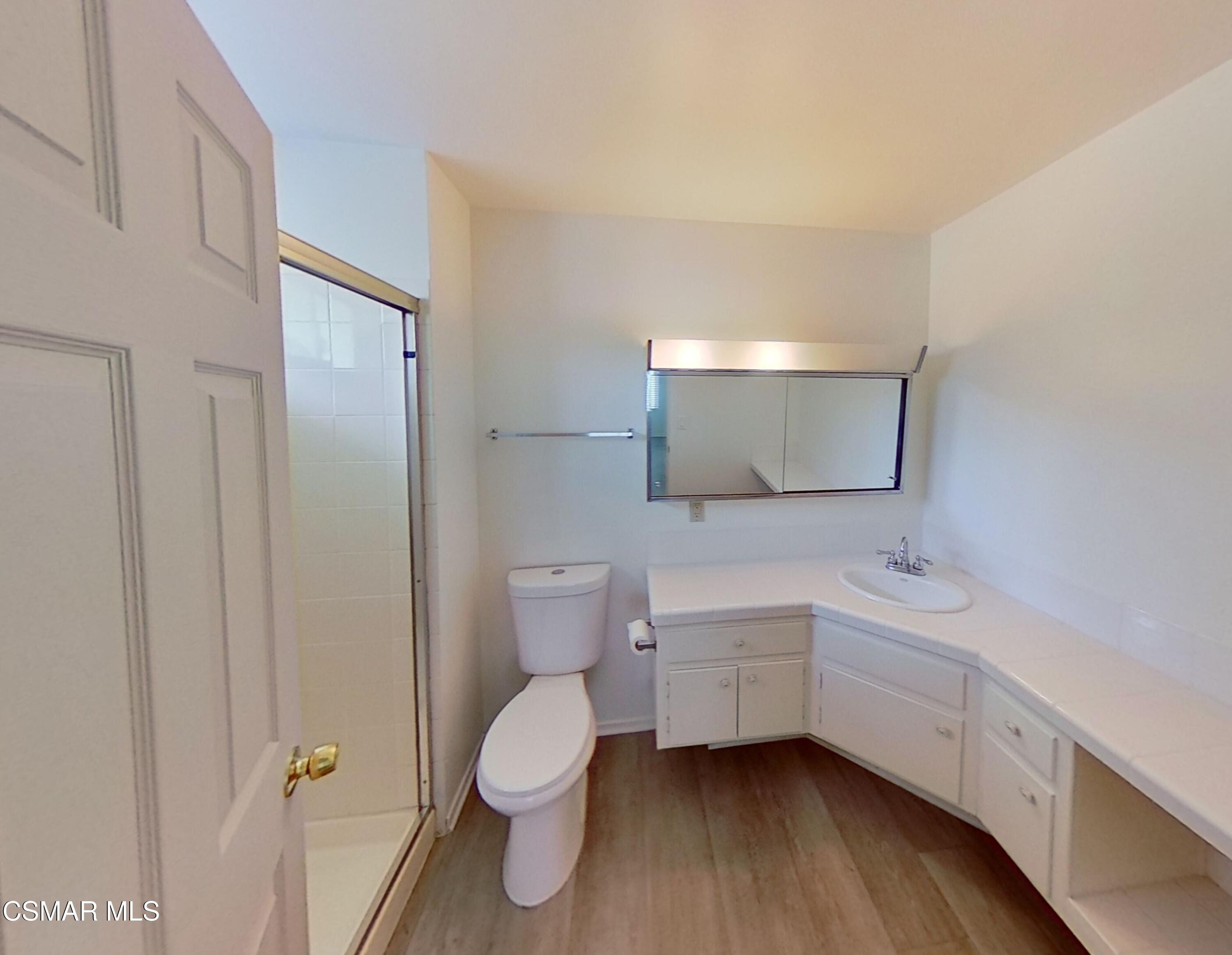 577 Appleton Road Simi Valley, CA 93065 - Photo 28 of 31 a bathroom with a toilet sink and mirror