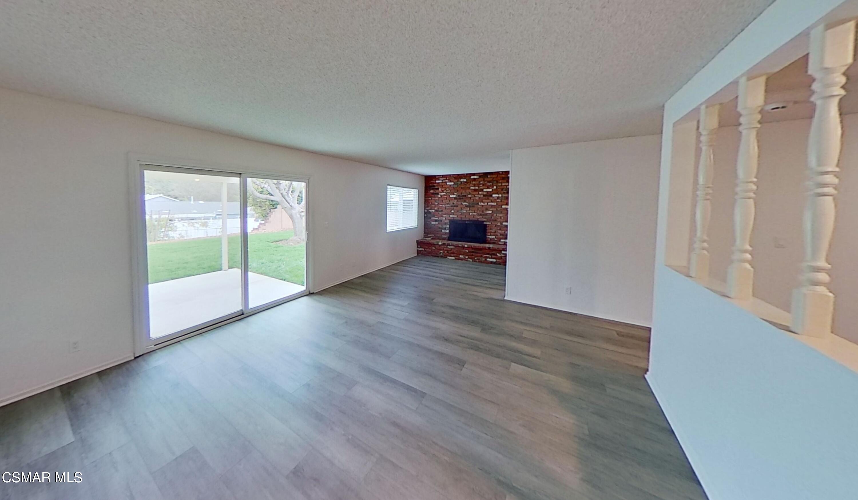 577 Appleton Road Simi Valley, CA 93065 - Photo 6 of 31 an empty room with wooden floor and windows