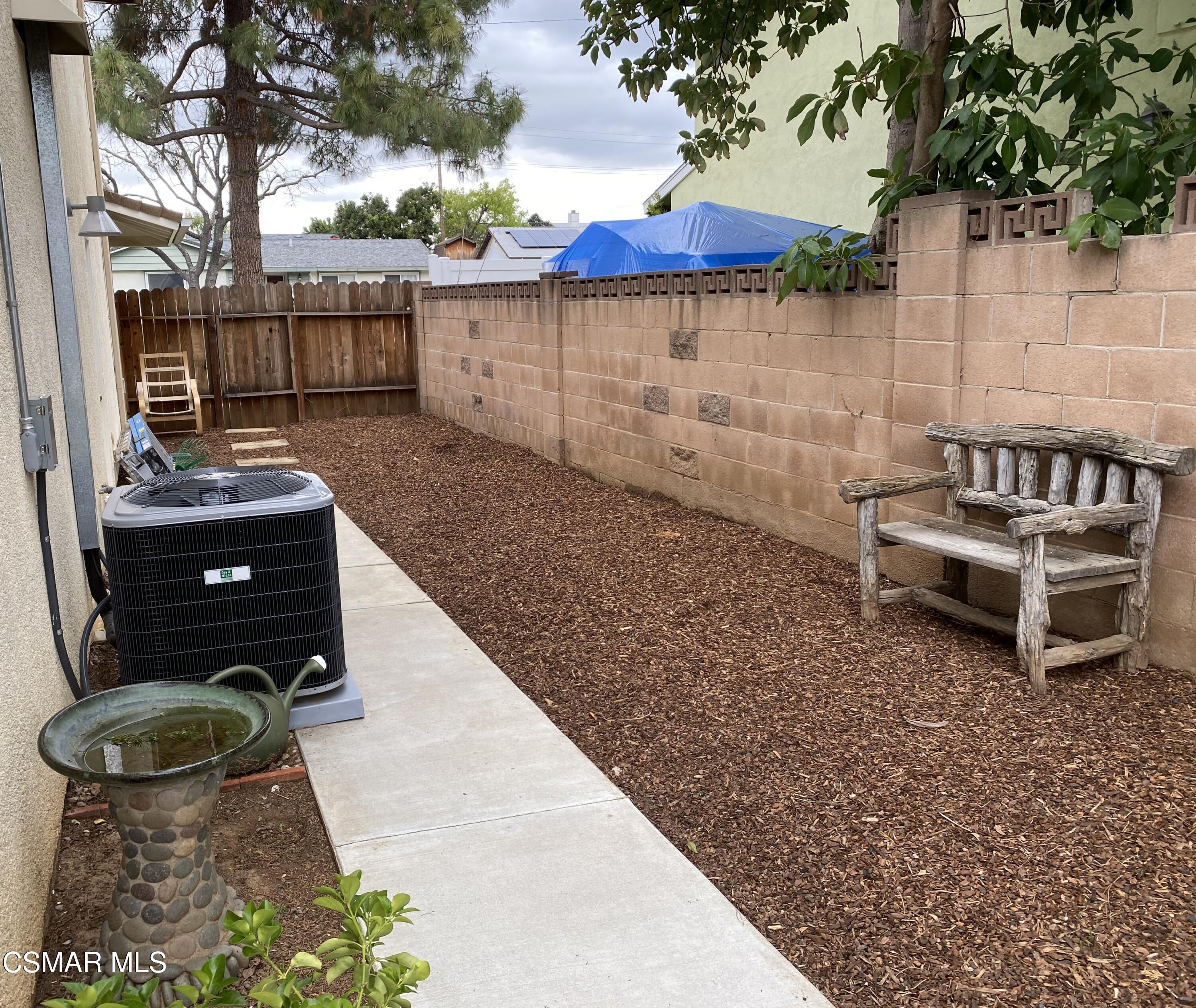 577 Appleton Road Simi Valley, CA 93065 - Photo 10 of 31 a backyard of a house with table and chairs
