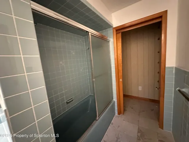 a view of a balcony with wooden floor