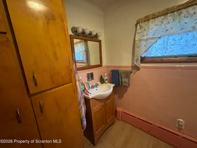 a bathroom with a sink and mirror