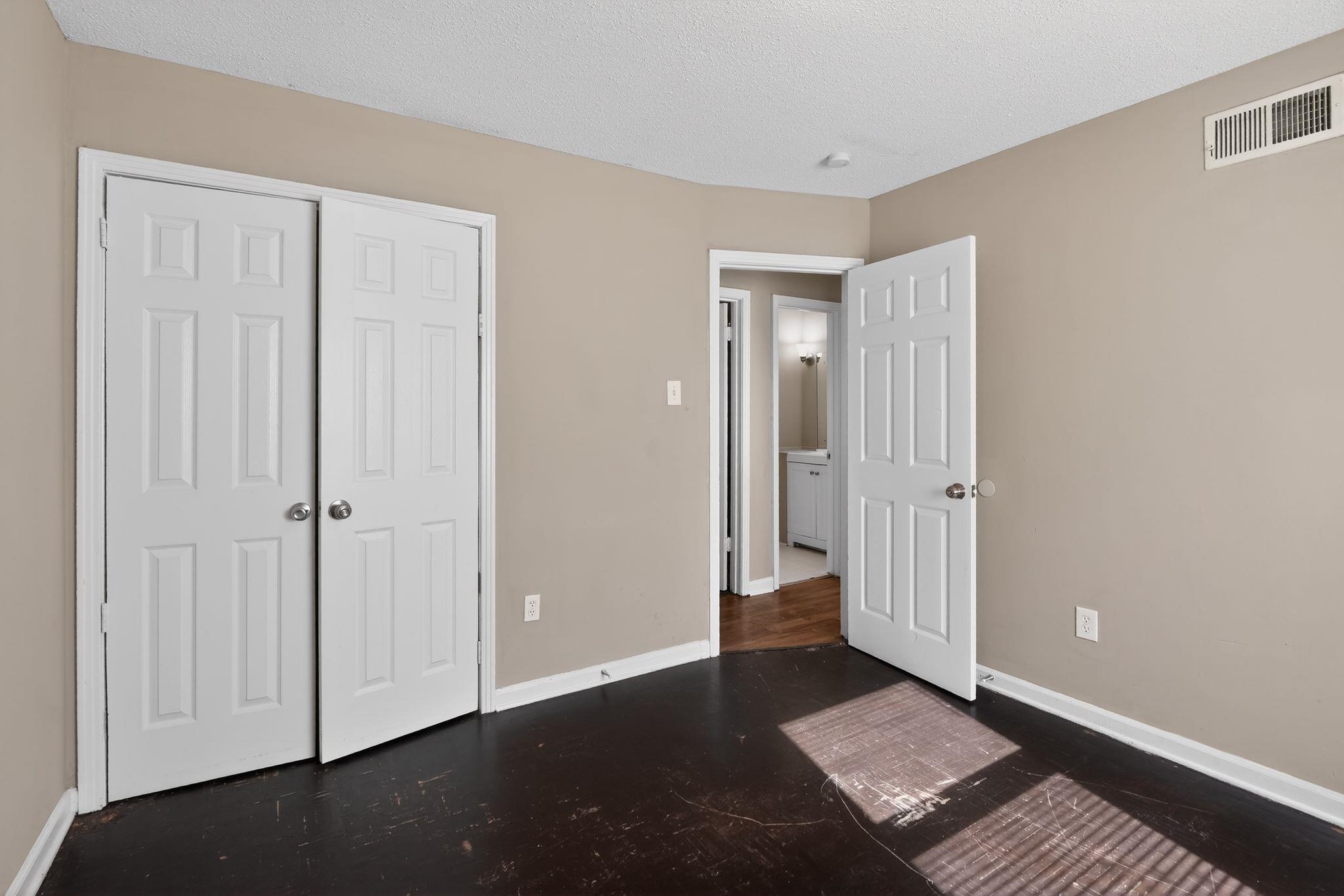 4587 Appleville Street Memphis, TN 38109 - Photo 22 of 34 Unfurnished bedroom featuring a closet and a textured ceiling