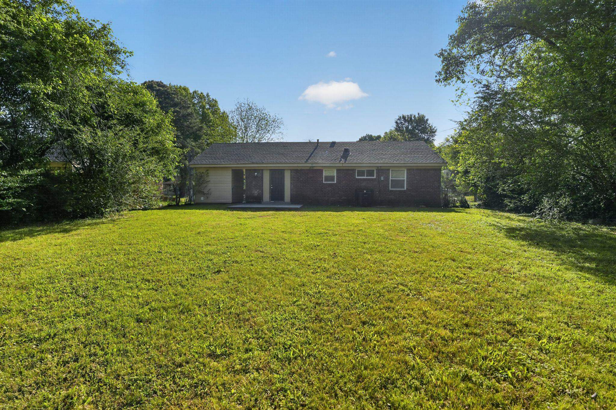 4587 Appleville Street Memphis, TN 38109 - Photo 34 of 34 Back of property with a yard and a patio