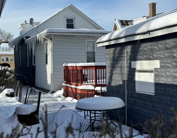 a balcony with table and chairs