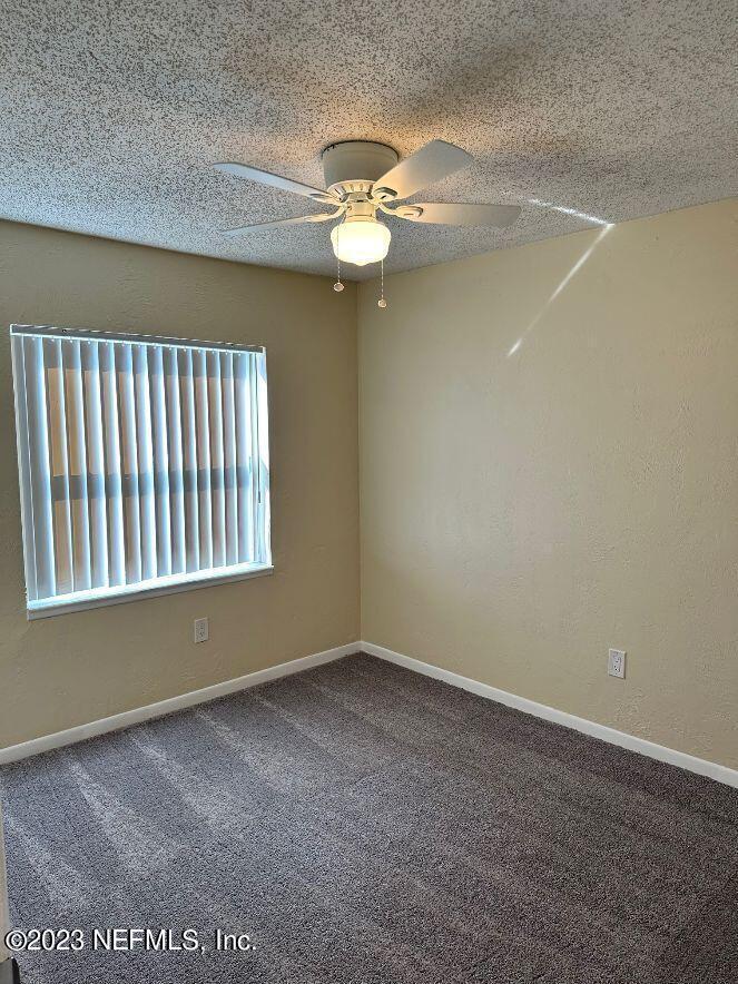 58 Masters Drive, Unit B St. Augustine, FL 32084 - Photo 10 of 10 a view of an empty room with a window