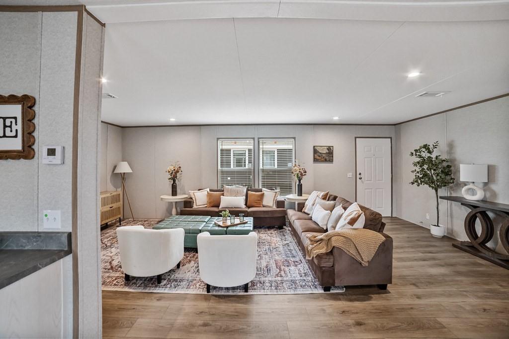 2013 Buffet Way Poolville, TX 76487 - Photo 2 of 37 a living room with fireplace furniture and a wooden floor