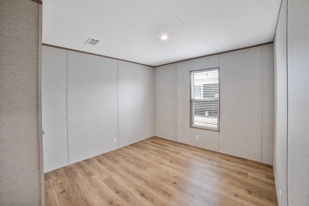 2013 Buffet Way Poolville, TX 76487 - Photo 22 of 37 a view of empty room with wooden floor and fan