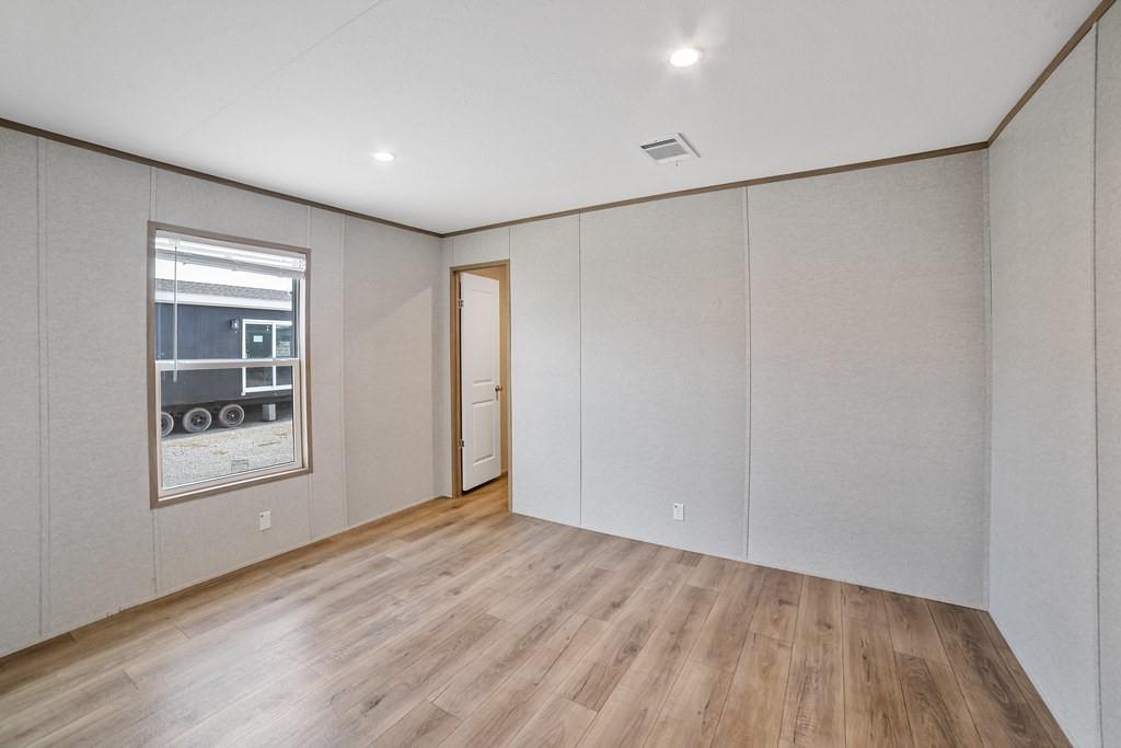 2013 Buffet Way Poolville, TX 76487 - Photo 23 of 37 a view of an empty room with wooden floor and a window
