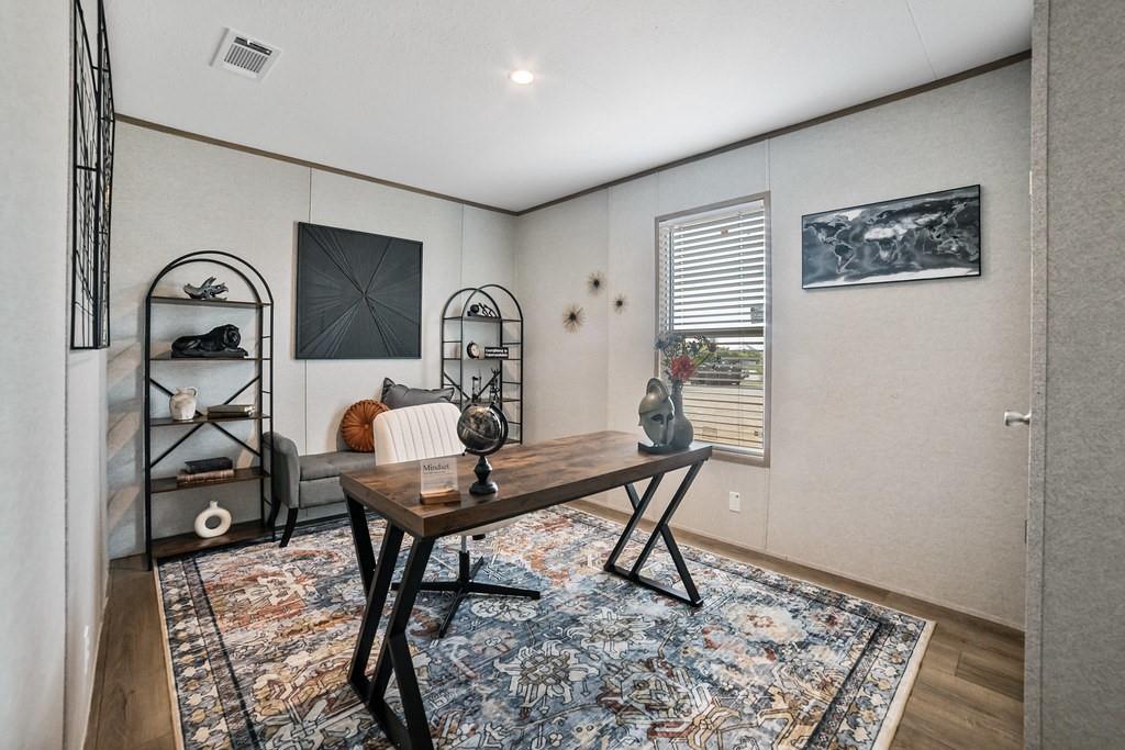 2013 Buffet Way Poolville, TX 76487 - Photo 28 of 37 a view of a workspace room with furniture and wooden floor