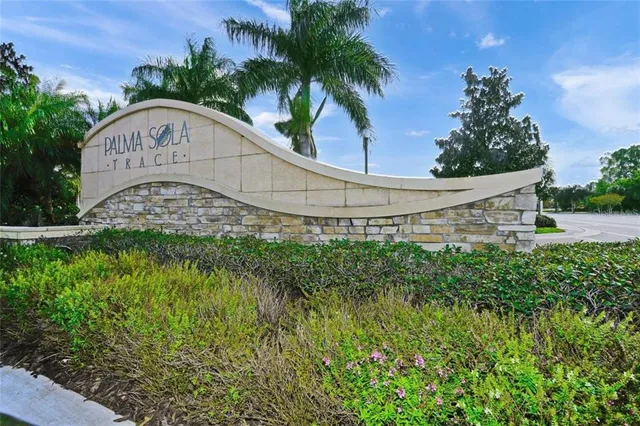 a view of a garden with a building in the background