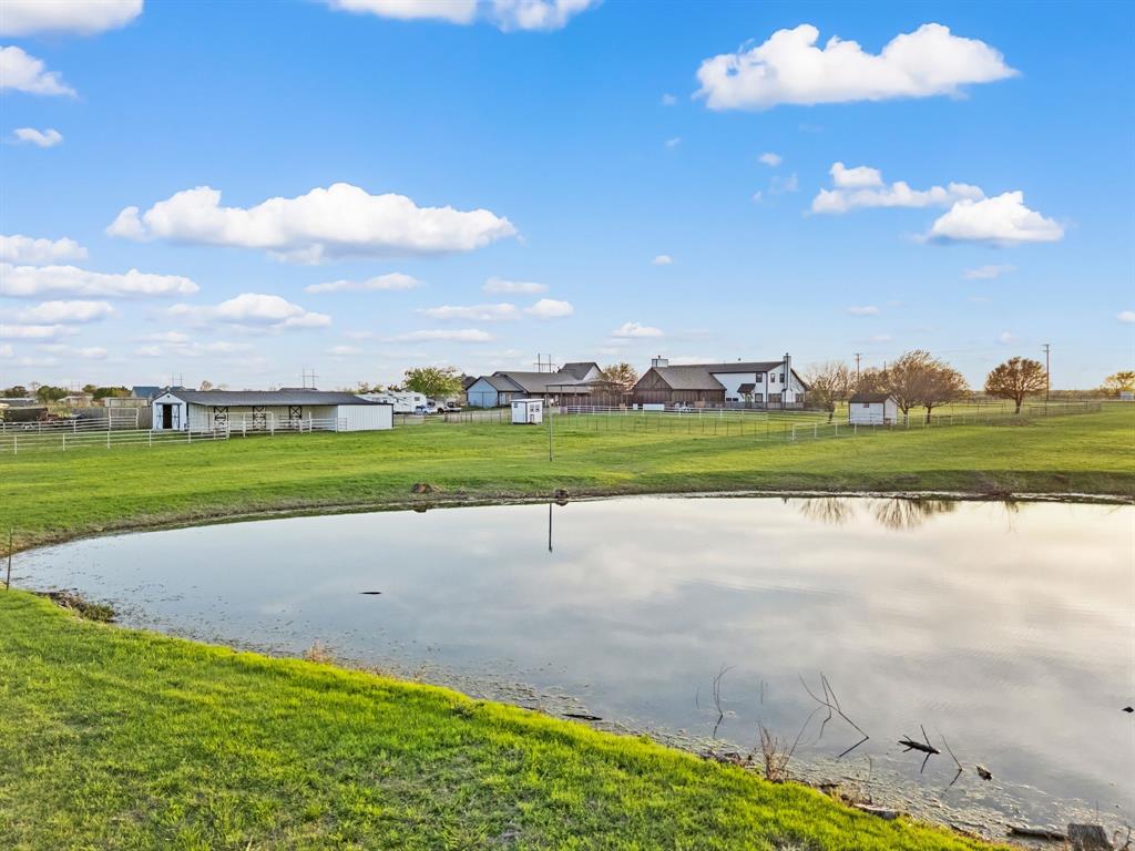 7384 Rector Road Sanger, TX 76266 - Photo 26 of 40 a view of a golf course with a lake