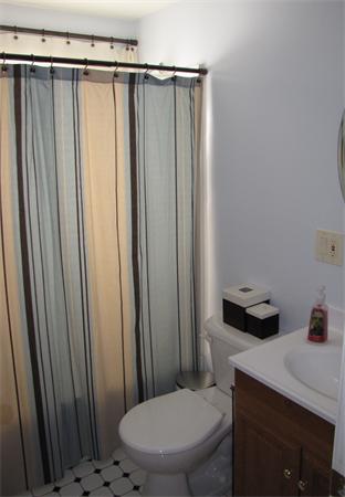 121 Cambridge Road, Unit 3 Woburn, MA 01801 - Photo 14 of 21 a bathroom with a sink toilet and shower