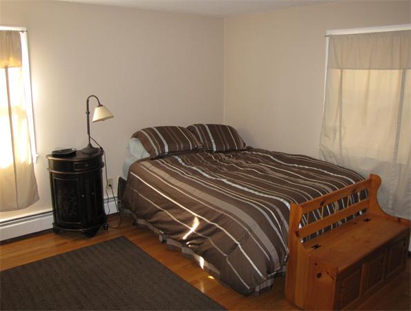 121 Cambridge Road, Unit 3 Woburn, MA 01801 - Photo 15 of 21 a bedroom with a bed and a window