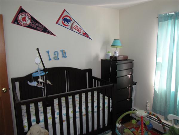 121 Cambridge Road, Unit 3 Woburn, MA 01801 - Photo 19 of 21 a bedroom with a bed and wooden floor